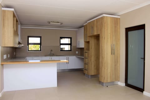 Apartment | Private kitchen | Coffee/tea maker, full-size fridge, microwave, oven