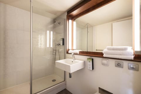 Shower, eco-friendly toiletries, hair dryer, towels