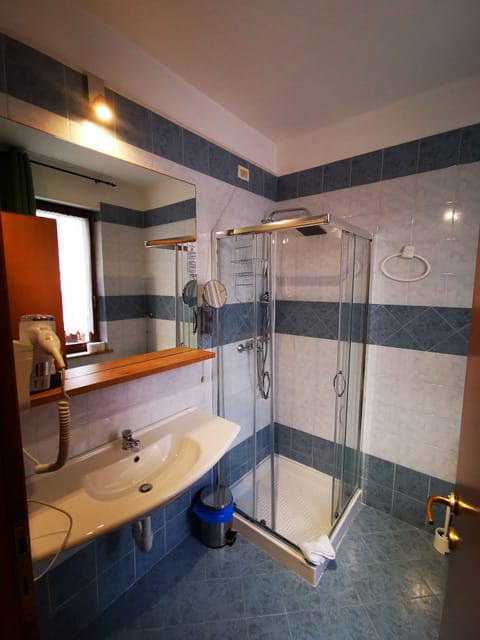 Shower, rainfall showerhead, designer toiletries, hair dryer