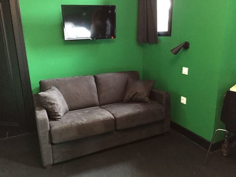 Triple Room | Living area | 82-cm flat-screen TV with cable channels, TV