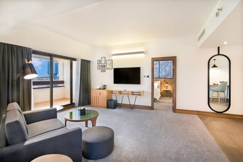 Deluxe Suite, 1 Bedroom | Minibar, in-room safe, desk, soundproofing