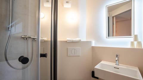 Shower, eco-friendly toiletries, towels, soap