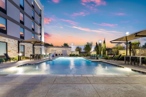 Outdoor pool, open 10:00 AM to 10 PM, pool umbrellas, sun loungers