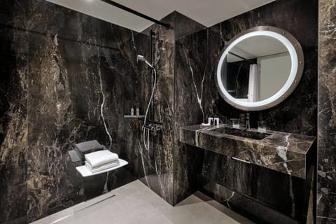 Combined shower/tub, free toiletries, hair dryer, bathrobes