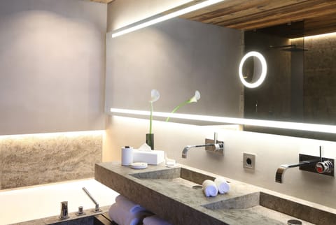 Family Suite, Balcony, Mountain View, Fireplace | Bathroom | Separate tub and shower, rainfall showerhead, free toiletries