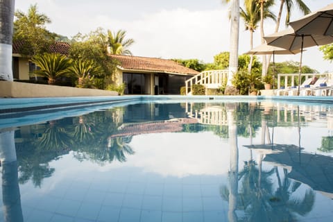 Outdoor pool, open 8:00 AM to 8:00 PM, pool umbrellas, sun loungers