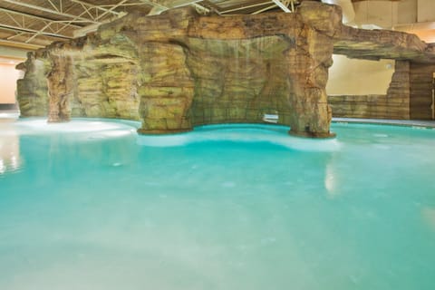 Indoor pool, 3 outdoor pools, open 8:00 AM to 10:00 PM, pool umbrellas