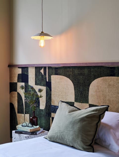 Premium bedding, desk, laptop workspace, blackout drapes