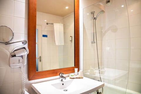 Shower, free toiletries, hair dryer, slippers