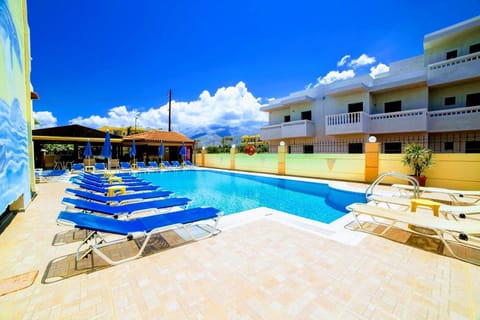 Seasonal outdoor pool, open 9:00 AM to 7:00 PM, pool umbrellas