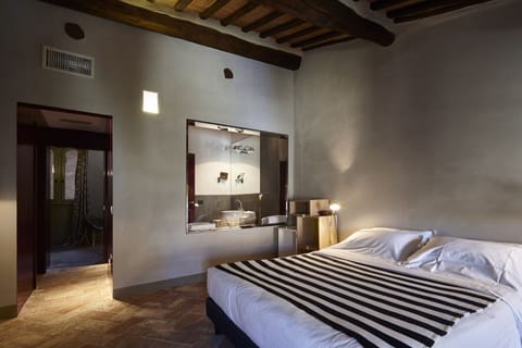 Premium bedding, down comforters, memory foam beds, minibar