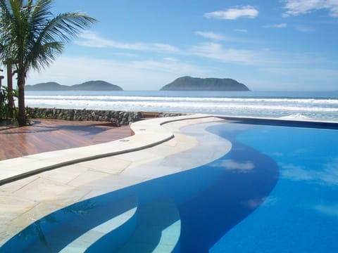 Outdoor pool, open 11:00 AM to 8:00 PM, pool umbrellas