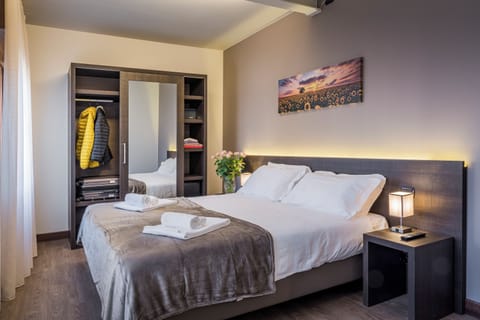 Superior Triple Room | Down comforters, in-room safe, individually decorated