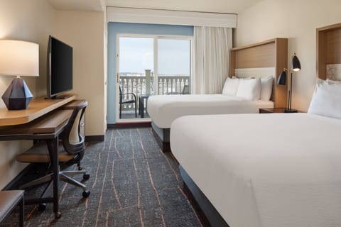 Suite, 2 Queen Beds (Additional Living Area) | Desk, laptop workspace, blackout drapes, iron/ironing board