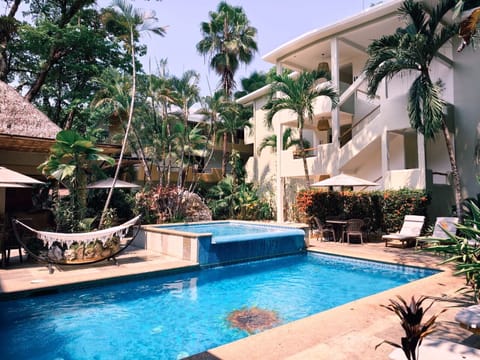 Outdoor pool, pool umbrellas, sun loungers