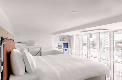 Premium bedding, down comforters, memory foam beds, minibar