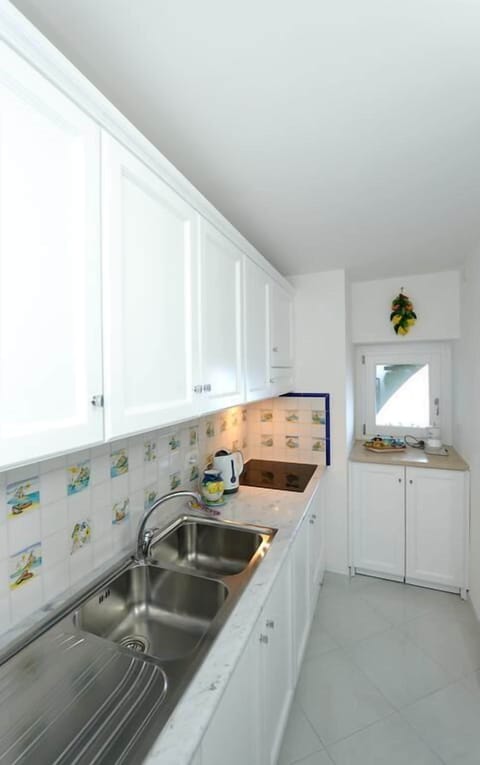Deluxe Apartment, 1 Bedroom, Balcony, Sea View | Private kitchen | Fridge, microwave, stovetop, dishwasher