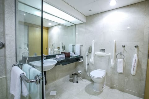 Deep soaking tub, rainfall showerhead, eco-friendly toiletries