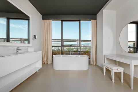 Designer toiletries, hair dryer, bathrobes, slippers