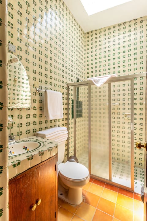 Superior Studio Suite, 2 Bedrooms | Bathroom | Shower, rainfall showerhead, free toiletries, hair dryer