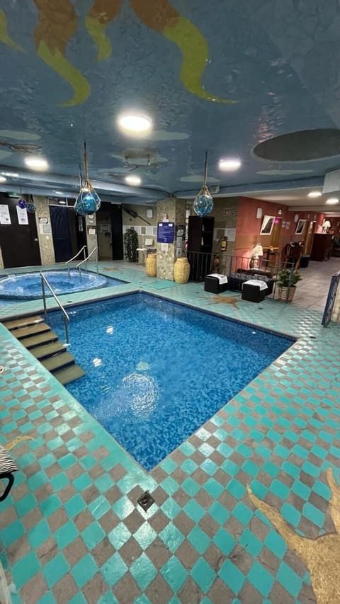 Indoor pool, open 10:00 AM to 10:00 PM, sun loungers