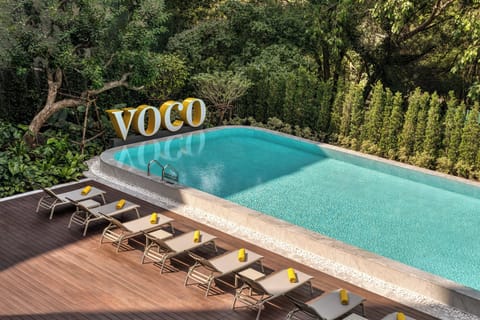 Outdoor pool, open 7:00 AM to 8:00 PM, pool umbrellas