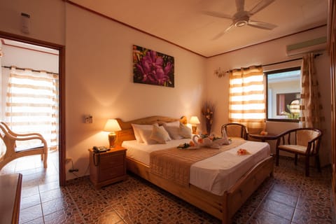 Standard Apartment, 1 Double Bed, Garden View, Garden Area | 1 bedroom, minibar, in-room safe, desk