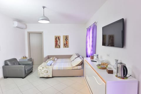 Apartment, 1 Bedroom | Living room | 43-inch flat-screen TV with digital channels, TV