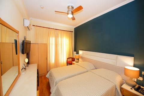 Double or Twin Room | Pillowtop beds, minibar, in-room safe, desk