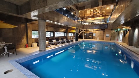 Indoor pool, open 3:00 PM to 9:00 PM, pool umbrellas