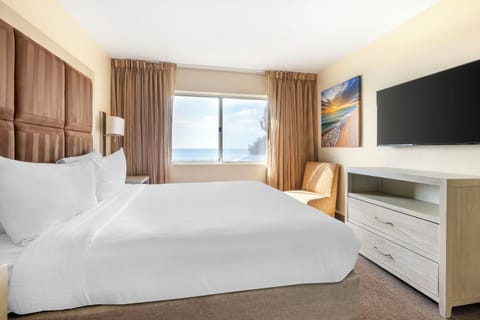 Laptop workspace, bed sheets