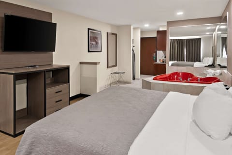 Suite, 1 King Bed, Non Smoking, Jetted Tub | Premium bedding, desk, blackout drapes, soundproofing