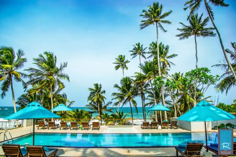 On the beach, sun loungers, beach umbrellas