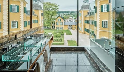 Suite (Infinity) | Bathroom | Deep soaking tub, rainfall showerhead, designer toiletries, hair dryer
