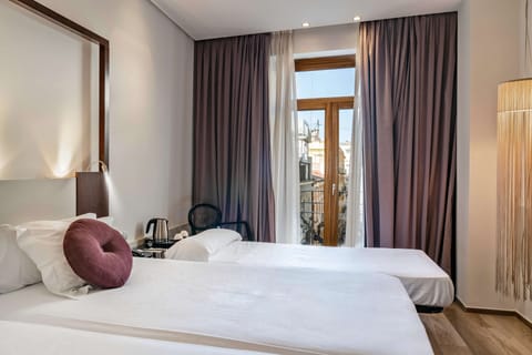 Premium bedding, down comforters, minibar, in-room safe