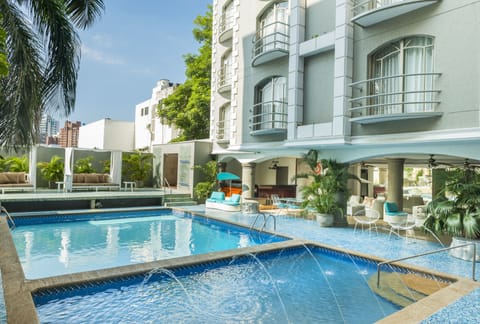 Outdoor pool, open 8:00 AM to 8:00 PM, pool umbrellas, sun loungers
