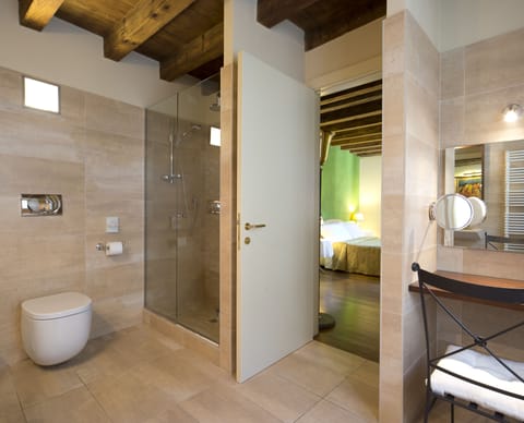 Shower, rainfall showerhead, designer toiletries, hair dryer