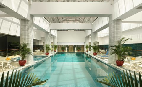 Indoor pool, open 6:00 AM to 11:00 PM, sun loungers, lifeguards on site