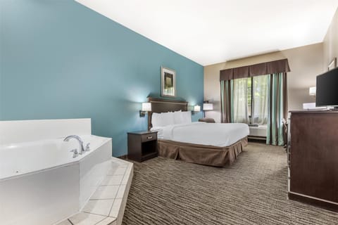 Suite, 1 King Bed, Non Smoking, Jetted Tub | Iron/ironing board, WiFi (free), bed sheets