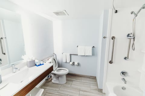 Room, 1 King Bed, Accessible (Comms Accessible. Roll-In Shower) | Bathroom | Hair dryer, towels