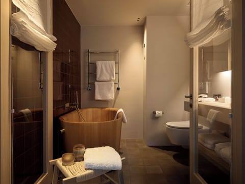 Suite | Bathroom | Hair dryer, bathrobes, slippers, heated floors