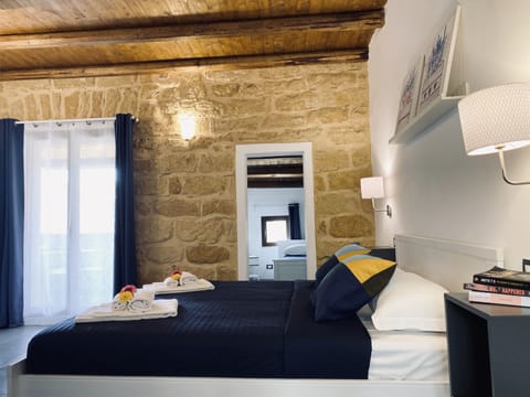 Deluxe Triple Room, Terrace, Garden View | Hypo-allergenic bedding, down comforters, minibar, desk
