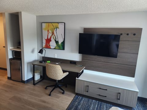 Premium bedding, desk, laptop workspace, iron/ironing board