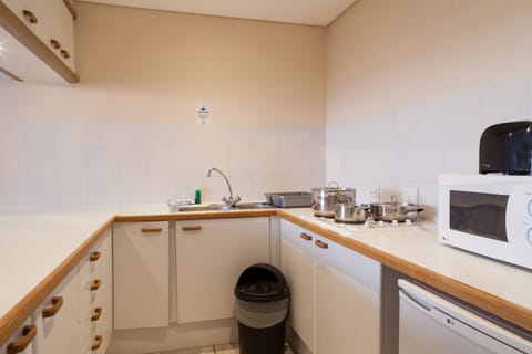 Microwave, stovetop, coffee/tea maker, electric kettle