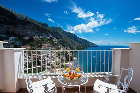 Superior Double Room, Terrace, Sea View | Minibar, in-room safe, desk, laptop workspace