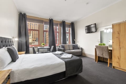 Deluxe Room | Desk, blackout drapes, iron/ironing board, cribs/infant beds