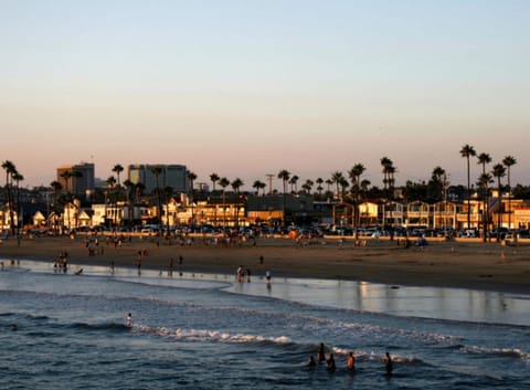 On the beach, white sand, beach towels, beach volleyball