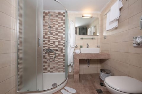 Shower, free toiletries, hair dryer, slippers