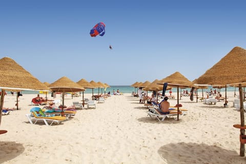 On the beach, sun loungers, beach umbrellas, beach bar