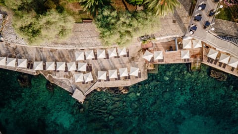 On the beach, white sand, sun loungers, beach umbrellas